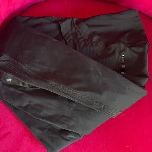 High waisted size 4 black shiny stripe on black leggings. Stripe entire of 25”.